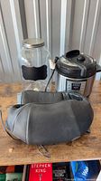 Overview of all three items: Instant Pot, shoulder neck massager, large glass jar