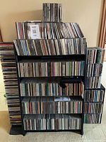 Full view of wide rack, two tower racks and CDs