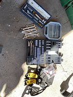 Overview of all items laid out including cases, wrenches, clamps, belt and hardware bag