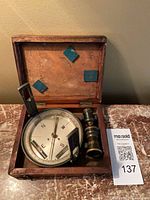 Compass and monocular inside wooden case