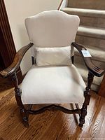 Front view of accent chair with pillow