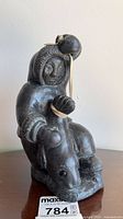 Front view of Wolf Originals Inuit hunter sculpture