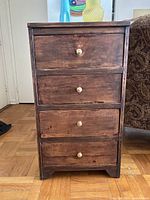 Front view of narrow 4-drawer chest