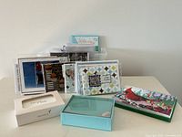 Group shot of all boxed sets and assorted sleeved cards