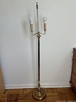 Full view of brass floor lamp showing height and base