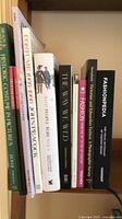 Shelf view showing spines of several fashion reference books