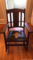 Front view of Mission-style oak rocking chair