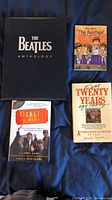 Front covers of four Beatles books laid out