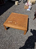 Top and legs of square wooden coffee table