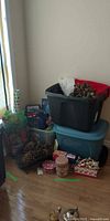 Overall view with storage totes, tree skirt, wreath and assorted holiday items