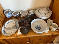 Full lot on shelf showing all stoneware pieces