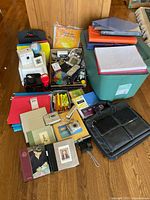 Overview showing electronics, bag, office supplies