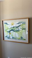 Front view of framed watercolour painting on wall