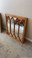 Front view of pine framed mirror with diamond window pane overlays