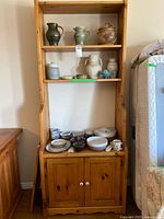 Full view of pine shelf with cabinet and adjustable shelves