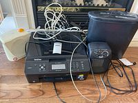 Brother printer, two space heaters, shredder and cables on floor