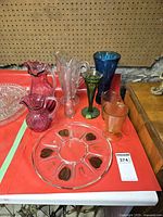 Group shot showing pitchers, vases, tumblers and both platters