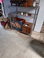 Full view of chrome wire shelving rack with three shelves