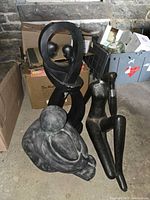 All three abstract human statues grouped together