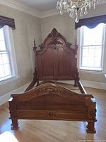 full view assembled queen bed frame showing headboard, footboard and side rails