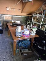Full view of rectangular solid wood table with items on top