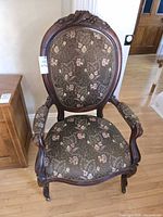 Front view of carved Victorian parlor chair
