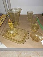 All seven amber glass pieces grouped together