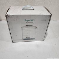 Sealed retail box showing Papablic baby bottle sterilizer