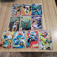 Group shot of ten comic books laid out on table