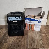 Front view of coin sorter next to box of coin wrappers