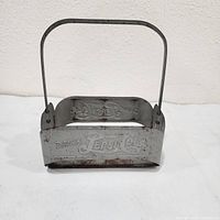 Front view showing embossed Pepsi-Cola logo and wire handle