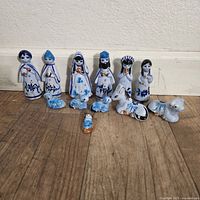 Front view of all 11 ceramic nativity pieces displayed upright