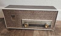 Front view of Philco AM/FM radio showing dial and knobs