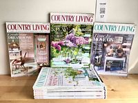 Front covers of three magazines plus stack