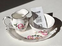 Full set showing creamer, sugar bowl, underplate with lot card