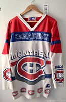 Front view of jersey showing team crest, CANADIENS and MONTREAL text, Starter sleeve patch
