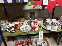 Shelf showing mugs, plates, pots, dinner plate