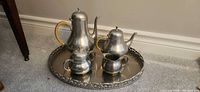 Full view of five-piece pewter set on tray