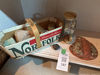 Entire lot showing basket with rocks, spiky shell, jar of shells and pottery piece