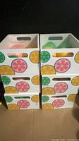 Six Citrus Toss wooden crates, open view showing identical citrus graphics