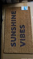 Front view of doormat showing SUNSHINE VIBES text
