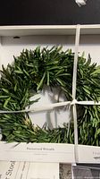 Front view of boxed preserved olive leaf wreath