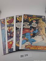 Front view of all four bagged comics in stack
