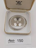 Medallion in open case showing Governors General side