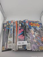 Front view showing stacked, bagged Batman comics
