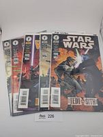 Five bagged Star Wars: Jedi vs. Sith comics fanned out showing cover art