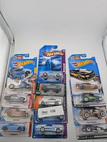 Group shot of all 12 Hot Wheels cars in blister packs