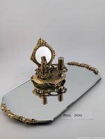 Top view of mirror tray with lipstick holder and tubes displayed