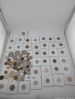 Overview of all 76 coins showing loose group and those in 2x2 flips