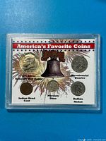 Front view of display showing all five coins in holder